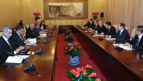 Vladimir Putin visits China