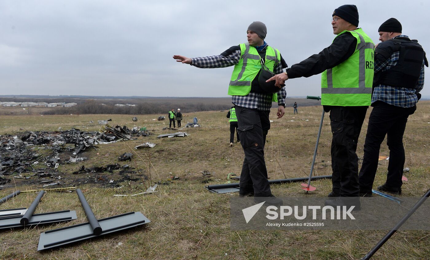 Dutch experts work at Malaysia Airlines Flight MH17 crash site