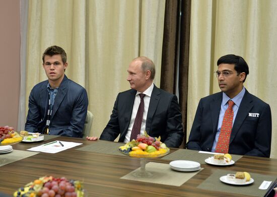 Vladimir Putin attends award ceremony for world chess champion