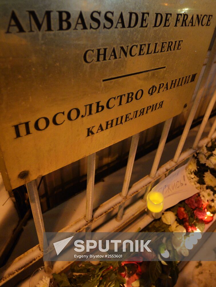 People lay flower by French Embassy in Moscow