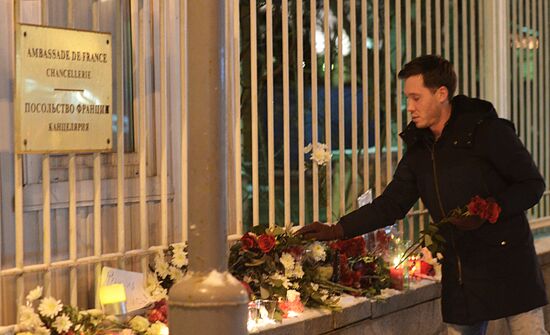 People lay flower at French Embassy in Moscow