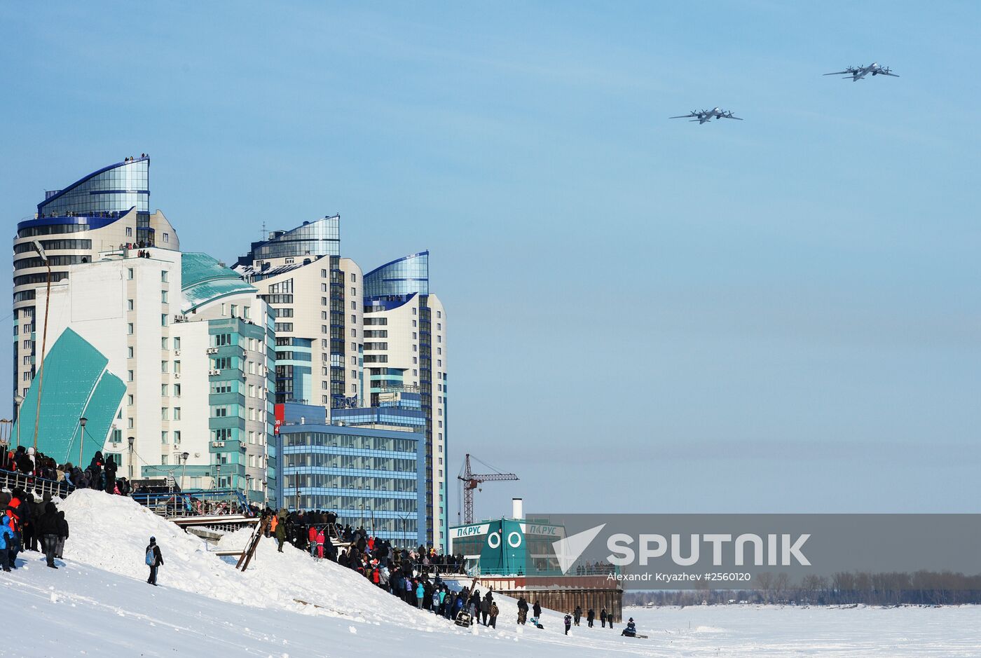 Tupolev 95 strategic bombers helicopters fly at an air show as part of the "Air Force Contract Service is Your Choice" campaign near the river terminal over the embankment in Barnaul. Location: Russia, Altai Krai Region, Barnaul. Author: Alexandr Kryazhev/Sputnik. "Air Force Contract Service is Your Choice" campaign