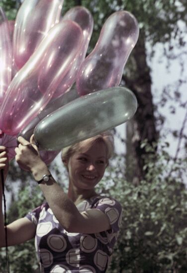 Young woman with balloons