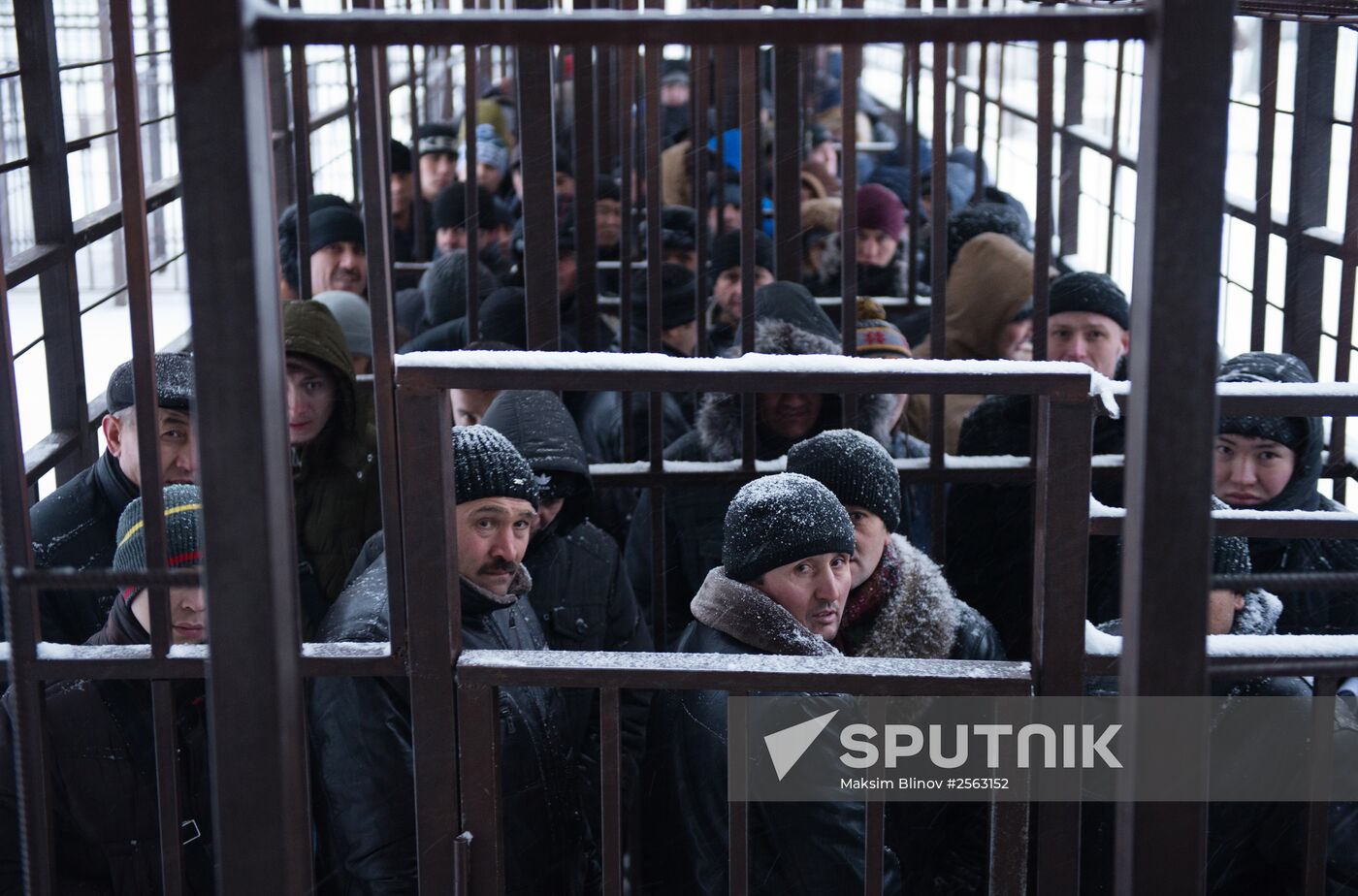 Immigrants line up at a Federal Migration Service division in Moscow