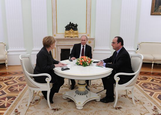 Russian President Vladimir Putin holds meeting with FRG Chancellor Angela Merkel and President of France Francois Hollande