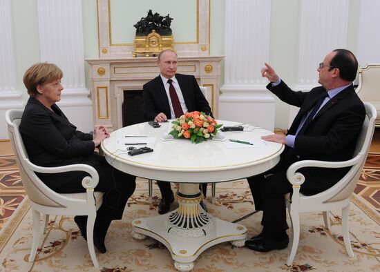 Russian President Vladimir Putin holds meeting with FRG Chancellor Angela Merkel and President of France Francois Hollande