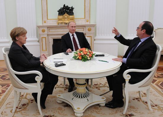 Russian President Vladimir Putin holds meeting with FRG Chancellor Angela Merkel and President of France Francois Hollande