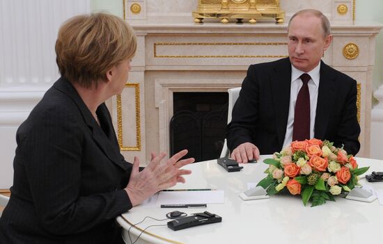 Russian President Vladimir Putin holds meeting with FRG Chancellor Angela Merkel and President of France Francois Hollande