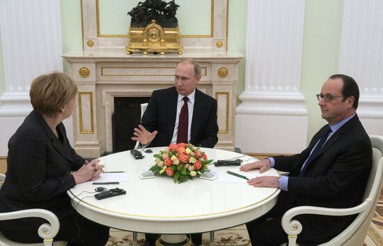Russian President Vladimir Putin holds meeting with FRG Chancellor Angela Merkel and President of France Francois Hollande