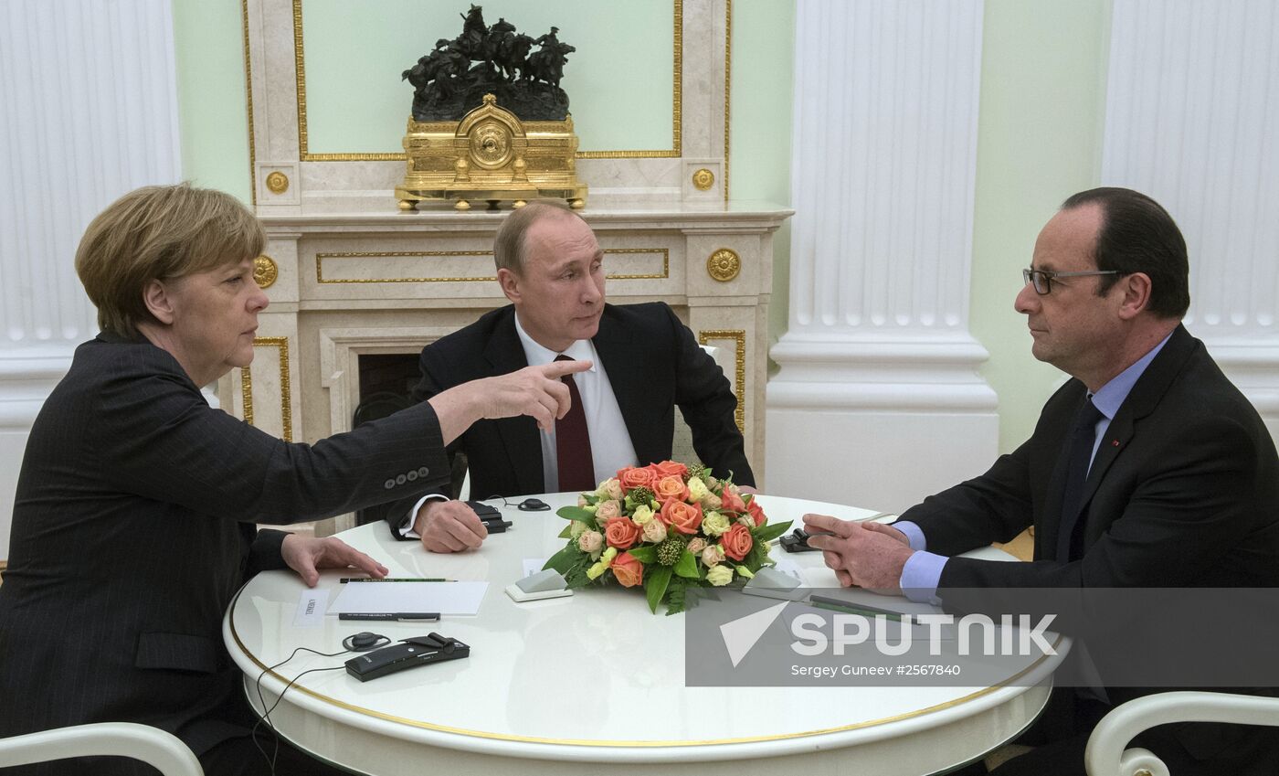 Russian President Vladimir Putin holds meeting with FRG Chancellor Angela Merkel and President of France Francois Hollande