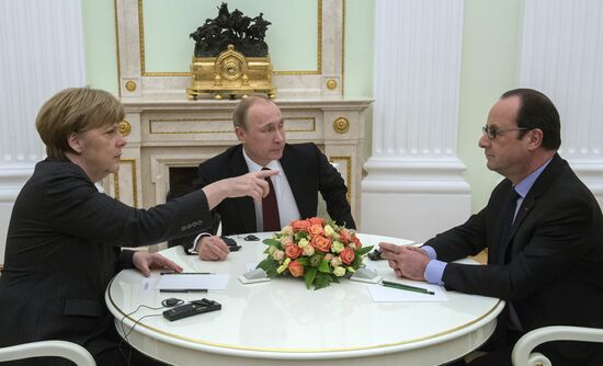 Russian President Vladimir Putin holds meeting with FRG Chancellor Angela Merkel and President of France Francois Hollande