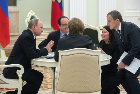 Russian President Vladimir Putin holds meeting with FRG Chancellor Angela Merkel and President of France Francois Hollande
