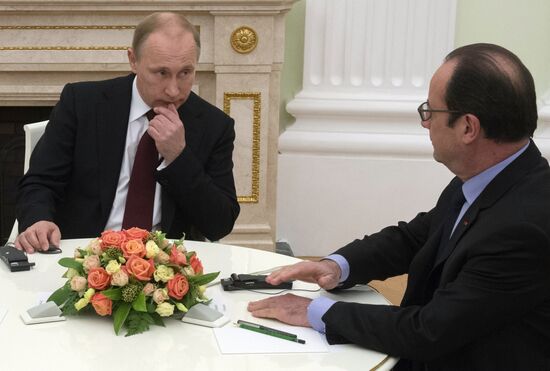 Russian President Vladimir Putin holds meeting with FRG Chancellor Angela Merkel and President of France Francois Hollande