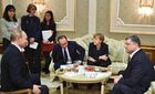 Foreground, from left: Russian President Vladimir Putin, French President Francois Hollande, German Chancellor Angela Merkel, and Ukrainian President Petro Poroshenko at Independence Palace in Minsk during the peace talks on Ukraine, February 11, 2015. Location: Belarus, Minsk. Author: Nikolay Lazarenko/Sputnik. Russian, German, French and Ukrainian leaders meet for talks in Minsk
