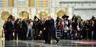 Foreground, from left: Russian President Vladimir Putin and Belarusian President Alexander Lukashenko walk past journalists at Independence Palace in Minsk before the peace talks on Ukraine, February 11, 2015. Location: Belarus, Minsk. Author: Nikolay Lazarenko/Sputnik. Russian, German, French and Ukrainian leaders meet for talks in Minsk