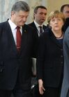 Foreground: Ukrainian President Petro Poroshenko and German Chancellor Angela Merkel at Independence Palace in Minsk after restricted attendance peace talks on Ukraine held by Russian, German, French and Ukrainian leaders, February 11, 2015. Location: Belarus, Minsk. Author: Viktor Tolochko/Sputnik. Russian, German, French and Ukrainian leaders meet for talks in Minsk
