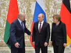 February 11, 2015. From left: Belarusian President Alexander Lukashenko, Russian President Vladimir Putin and German Federal Chancellor Angela Merkel pose for a group photo at Independence Palace in Minsk after restricted attendance peace talks on Ukraine held by the Russian, German, French and Ukrainian leaders. Location: Belarus, Minsk. Author: Viktor Tolochko/Sputnik. Russian, German, French and Ukrainian leaders meet for talks