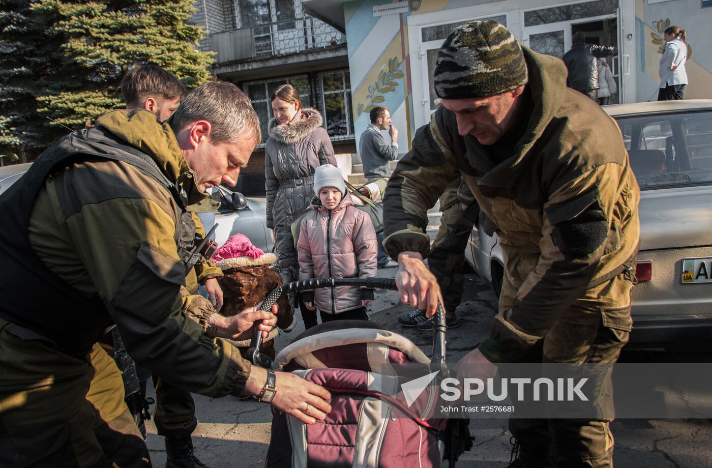 Militia of the Angel volunteer peacekeeping unit evacuate Donbas refugees