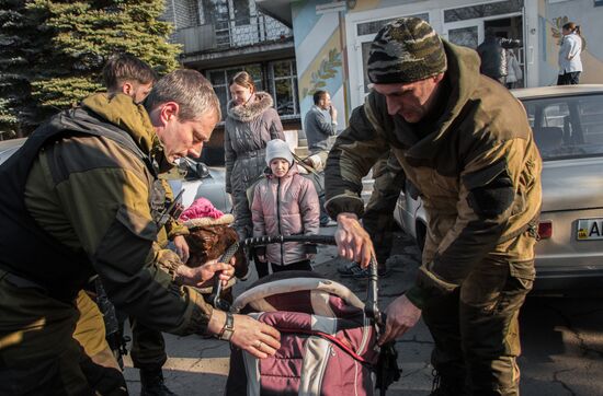 Militia of the Angel volunteer peacekeeping unit evacuate Donbas refugees