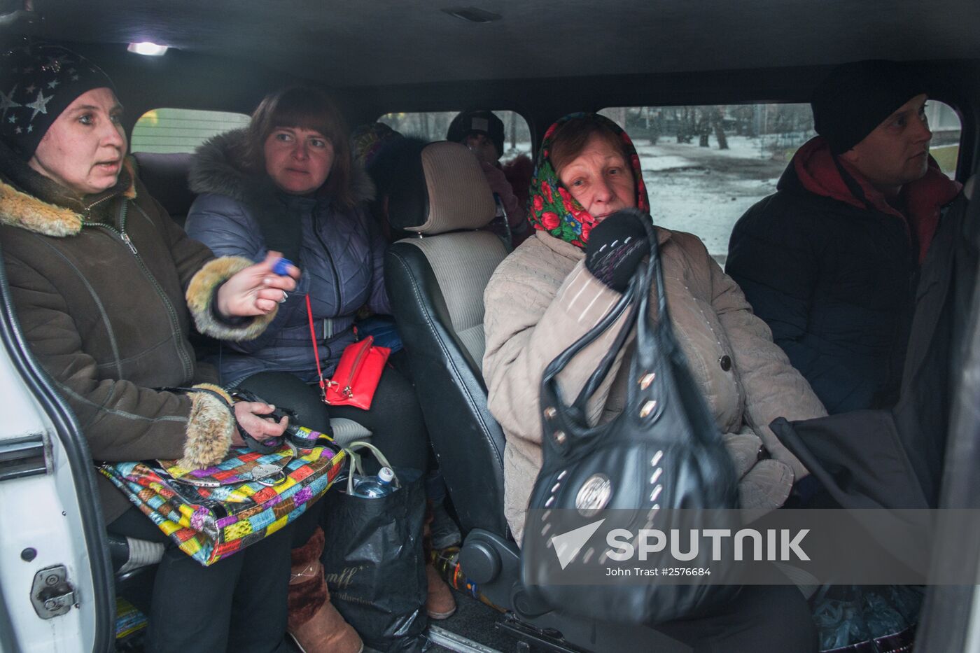 Militia of the Angel volunteer peacekeeping unit evacuate Donbas refugees