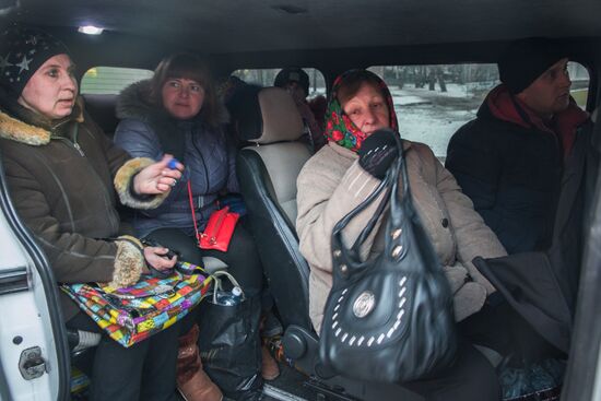 Militia of the Angel volunteer peacekeeping unit evacuate Donbas refugees