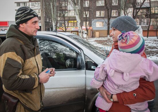 Militia of the Angel volunteer peacekeeping unit evacuate Donbas refugees