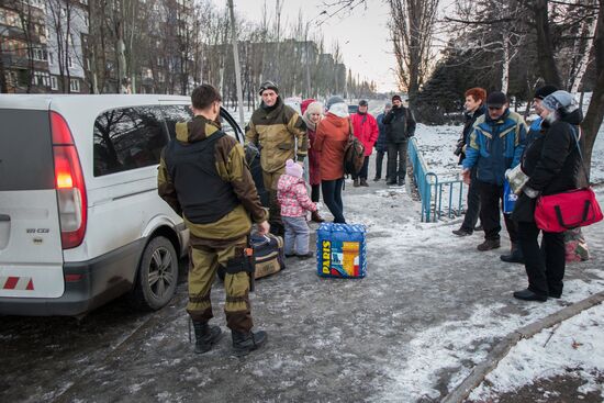 Militia of the Angel volunteer peacekeeping unit evacuate Donbas refugees