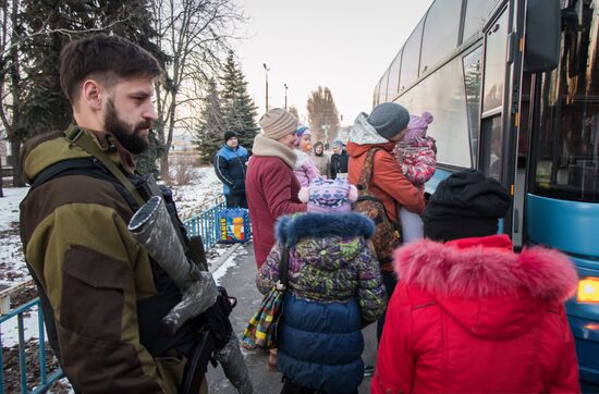 Militia of the Angel volunteer peacekeeping unit evacuate Donbas refugees