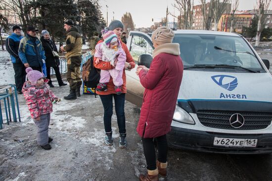 Militia of the Angel volunteer peacekeeping unit evacuate Donbas refugees