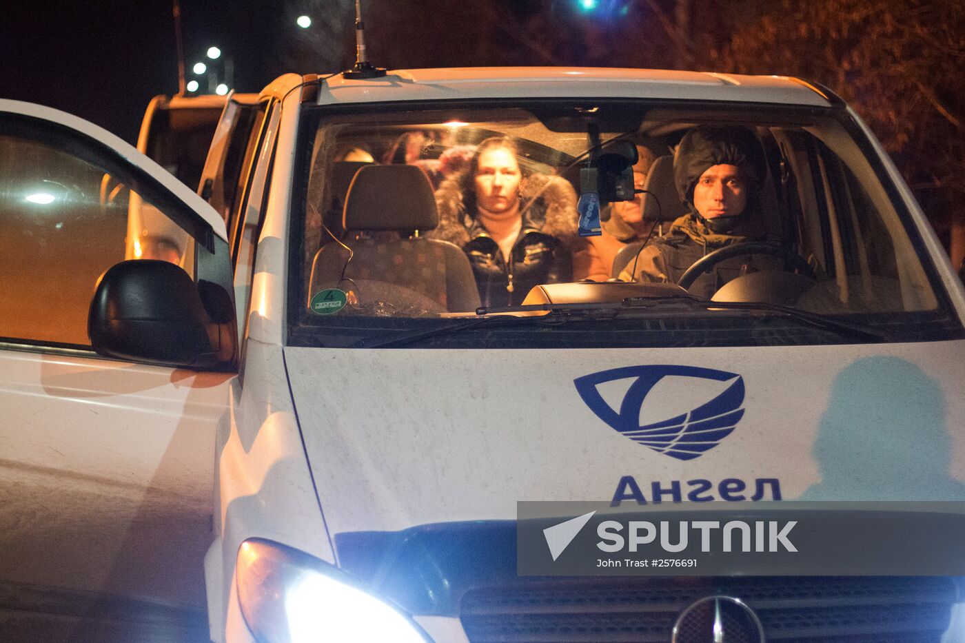 Militia of the Angel volunteer peacekeeping unit evacuate Donbas refugees