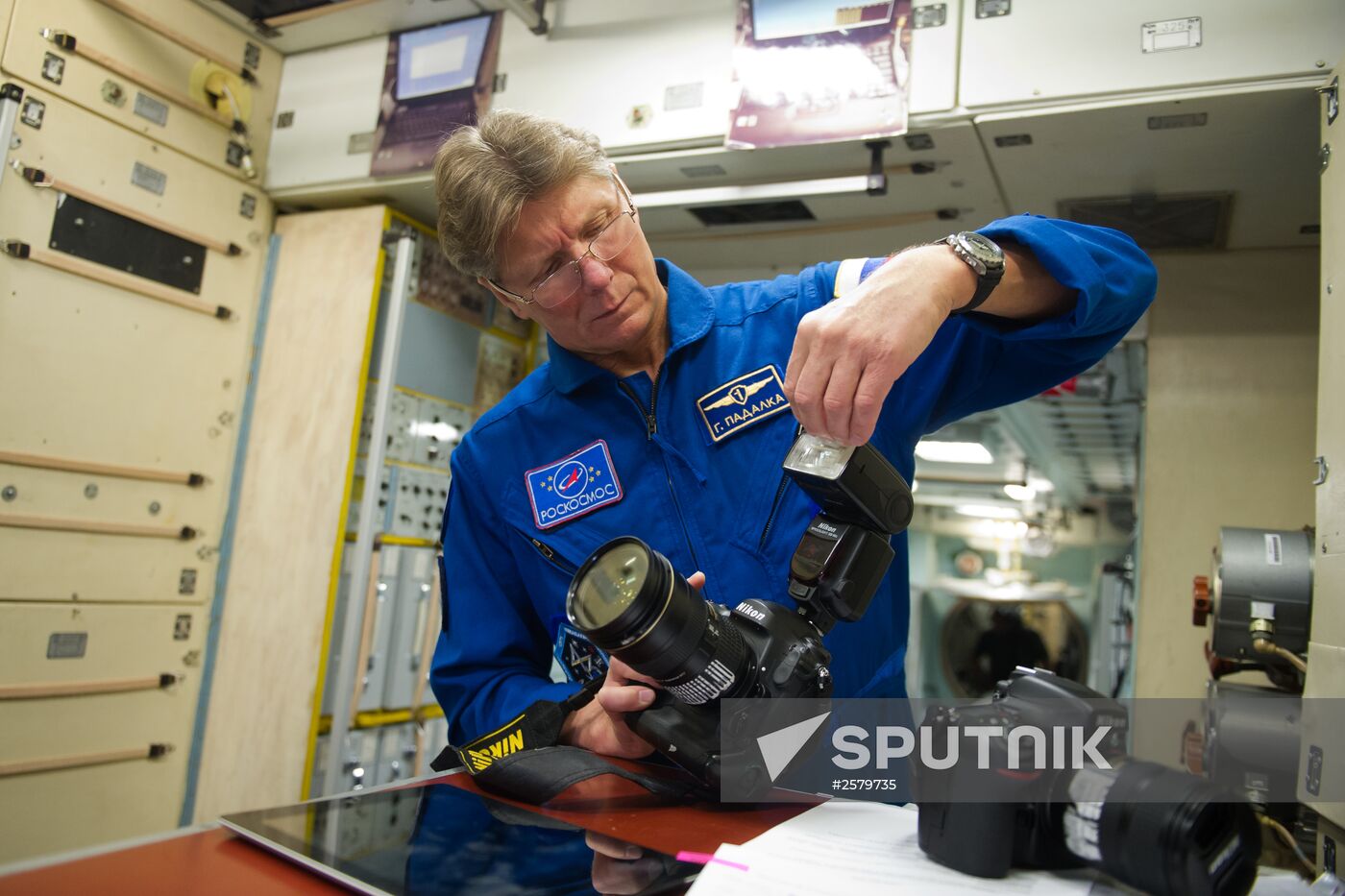 Cosmonauts exercising on ISS simulator