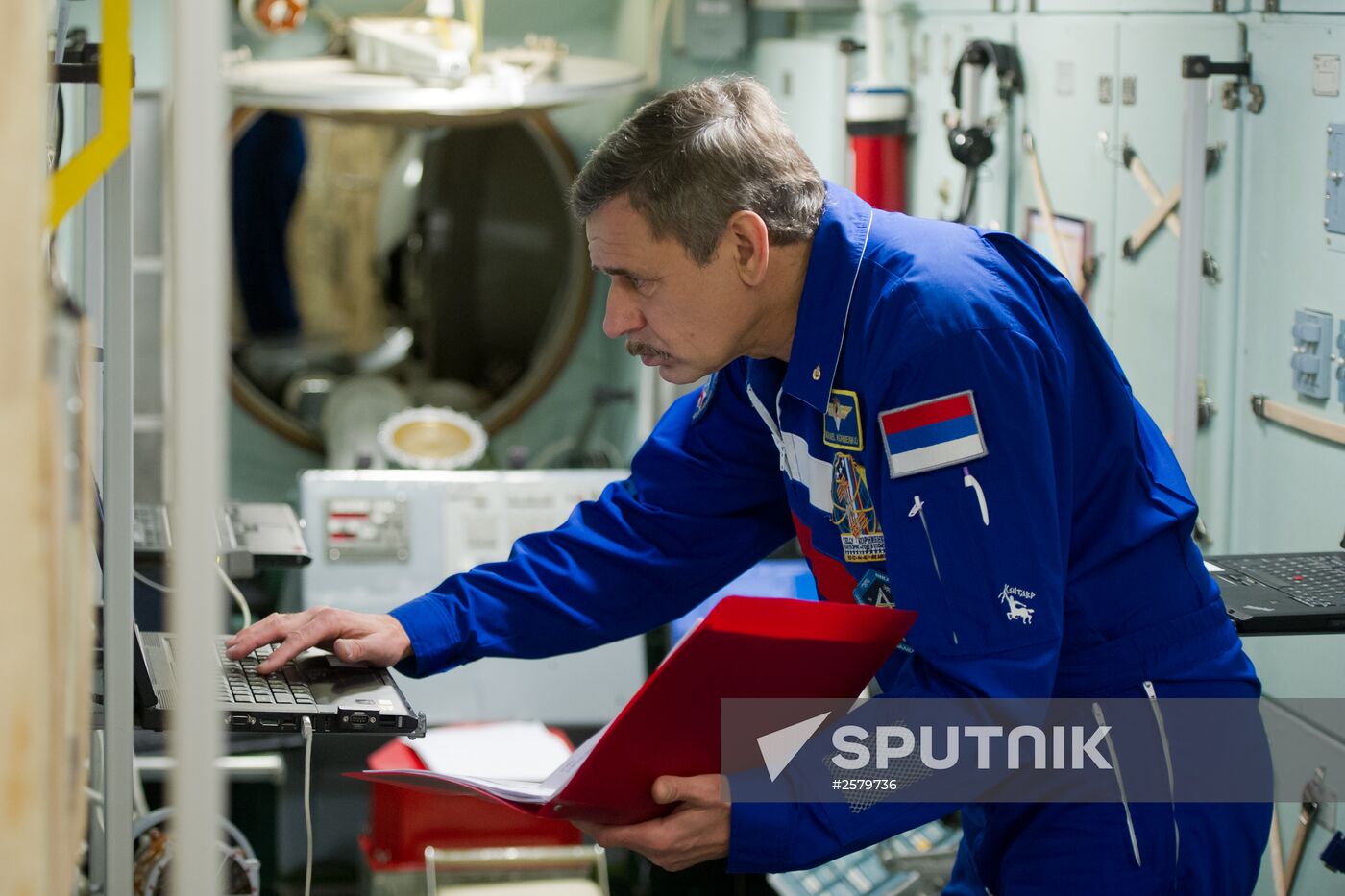 Cosmonauts exercising on ISS simulator
