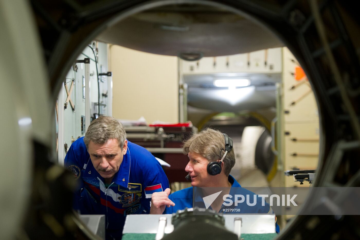 Cosmonauts exercising on ISS simulator