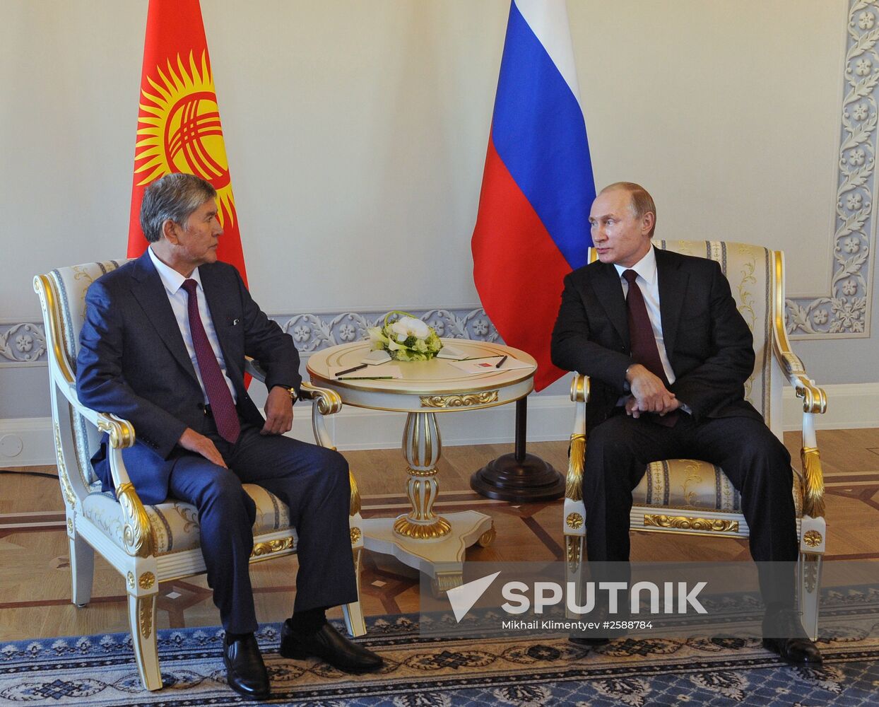 Russian President Vladimir Putin meets with Kyrgyz President Almazbek Atambayev in Strelna