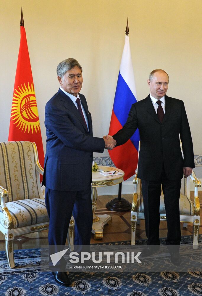 Russian President Vladimir Putin meets with Kyrgyz President Almazbek Atambayev in Strelna