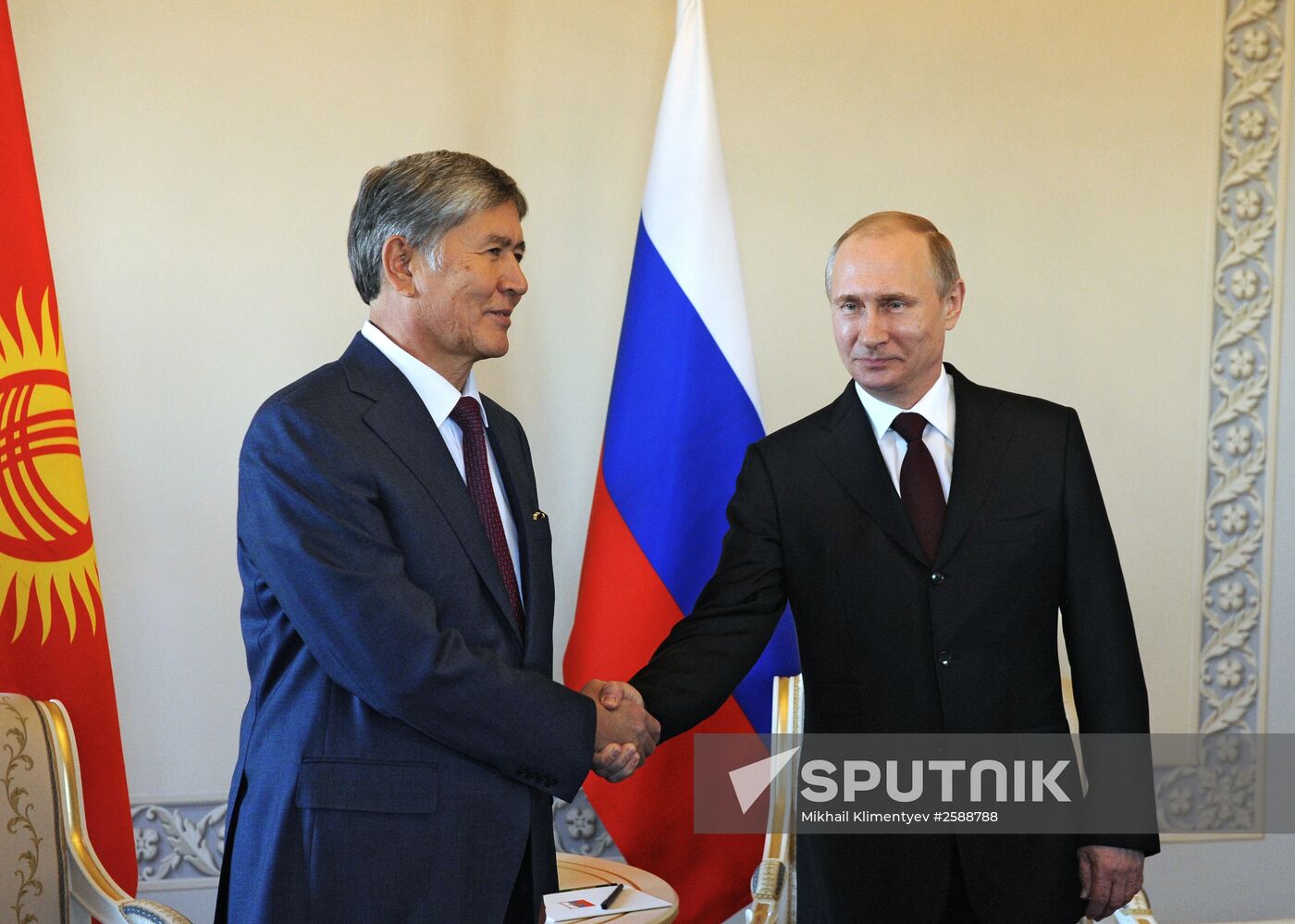 Russian President Vladimir Putin meets with Kyrgyz President Almazbek Atambayev in Strelna