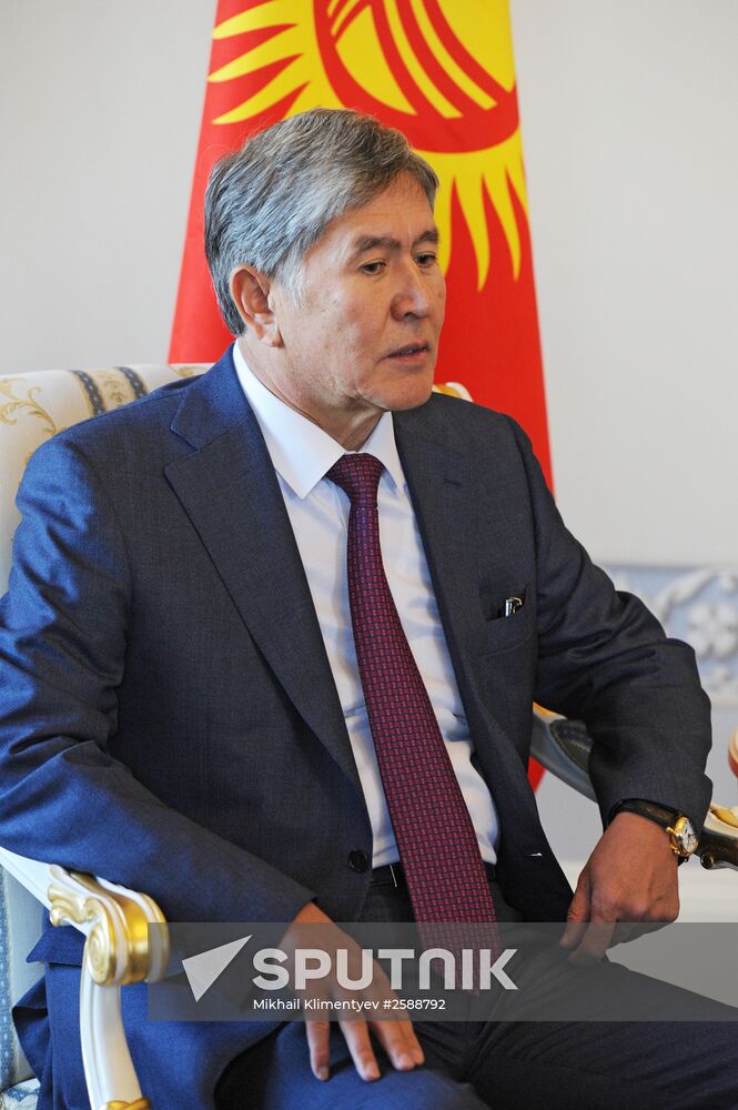 Russian President Vladimir Putin meets with Head of Kyrgyzstan Almazbek Atambayev in Strelna