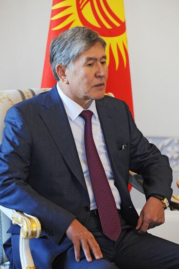 Russian President Vladimir Putin meets with Head of Kyrgyzstan Almazbek Atambayev in Strelna