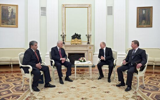 Russian President Vladimir Putin meets with South Ossetian President Leonid Tibilov