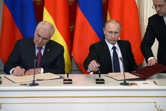 Russian President Vladimir Putin meets with South Ossetian President Leonid Tibilov
