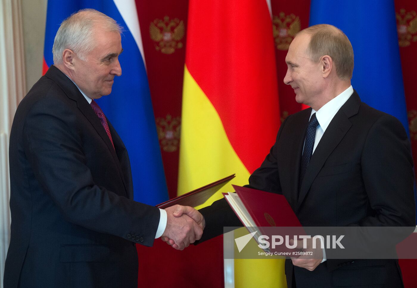 Russian President Vladimir Putin meets with South Ossetian President Leonid Tibilov