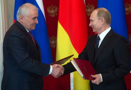Russian President Vladimir Putin meets with South Ossetian President Leonid Tibilov