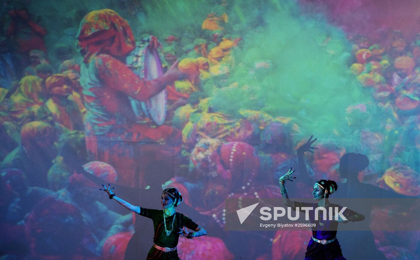 This girl is watching participants in the Ninth All-Russian Holi Mela (Festival of Colors) Indian Dance Festival in Moscow.