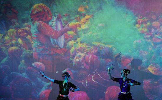 This girl is watching participants in the Ninth All-Russian Holi Mela (Festival of Colors) Indian Dance Festival in Moscow.