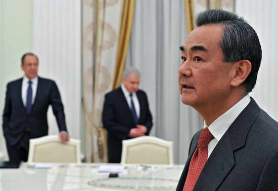 President Vldimir Putin meets with Chinese Foreign Minister Wang Yi