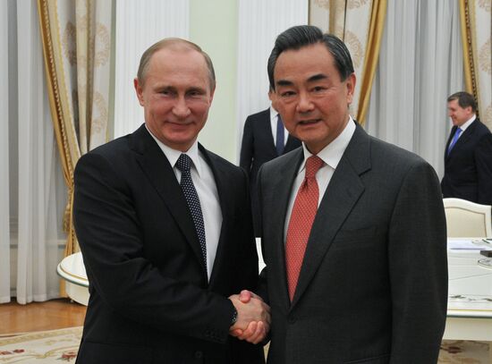 President Vladimir Putin meets with Chinese Foreign Minister Wang Yi