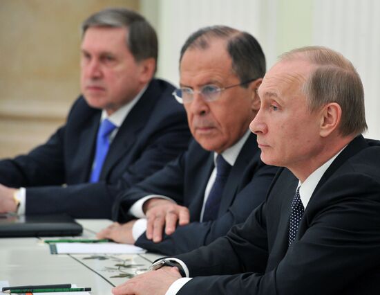 President Vldimir Putin meets with Chinese Foreign Minister Wang Yi