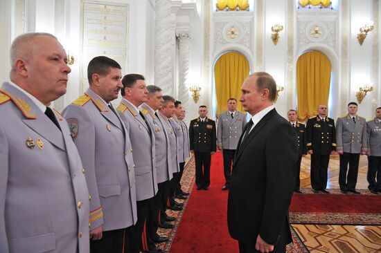 Russian President Vladimir Putin meets with senior officers and prosecutors in the Kremlin