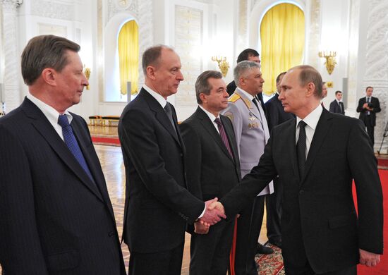Russian President Vladimir Putin meets with senior officers and prosecutors in the Kremlin