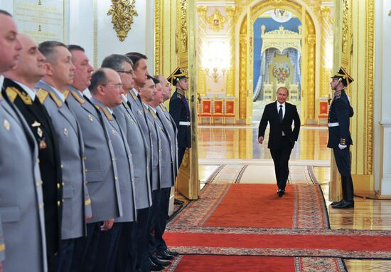 Russian President Vladimir Putin meets with senior officers and prosecutors in the Kremlin